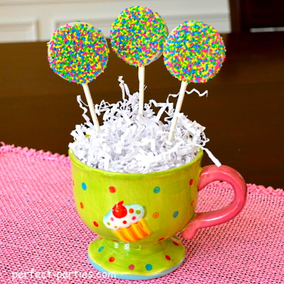 Oreo Pops with white chocolate and sprinkles.